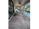 Covered patio features brick pavers and seating for six next to a screened pool at 1452 Moon Valley Dr, Davenport, FL 33896