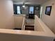 View looking down the carpeted stairs into the home's main living area at 1452 Moon Valley Dr, Davenport, FL 33896