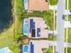 Aerial view showcasing pool, solar panels, and well-maintained yard at 14634 Astina Way, Orlando, FL 32837