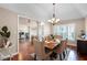 Elegant dining room featuring hardwood floors, chandelier, and seating for six at 14634 Astina Way, Orlando, FL 32837