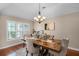 Formal dining room with decorative table set and chandelier, perfect for Gathering dinners at 14634 Astina Way, Orlando, FL 32837