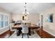 Bright dining room featuring a decorative table set, chandelier, and natural light at 14634 Astina Way, Orlando, FL 32837