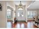 Inviting foyer showcasing the beautiful double doors with decorative glass and hardwood flooring at 14634 Astina Way, Orlando, FL 32837