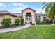 Charming single-Gathering home featuring a well-manicured lawn and a welcoming double door entrance at 14634 Astina Way, Orlando, FL 32837