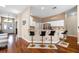 Kitchen with bar seating, modern appliances, white cabinets, and stainless steel refrigerator at 14634 Astina Way, Orlando, FL 32837
