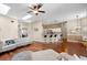 Open floor plan showcasing living room and kitchen with hardwood floors and natural light at 14634 Astina Way, Orlando, FL 32837