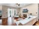 Cozy living room with hardwood floors, a fireplace, and access to the outdoors at 14634 Astina Way, Orlando, FL 32837