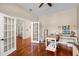 Versatile office space featuring french doors, hardwood floors, and natural lighting at 14634 Astina Way, Orlando, FL 32837
