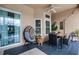 Covered patio featuring an outdoor dining table, an egg chair, and a view to the pool at 14634 Astina Way, Orlando, FL 32837