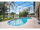 Gorgeous screened-in pool overlooking beautiful waterfront landscape at 14634 Astina Way, Orlando, FL 32837