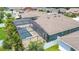 Aerial view showcasing the screened-in pool, patio, and landscaping of a well-maintained property at 1556 Alligator St, St Cloud, FL 34771