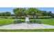 Inviting community space with benches and landscaped greenery creating a serene outdoor setting at 1556 Alligator St, St Cloud, FL 34771