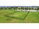 Large fenced dog park featuring green space, benches, and double-gated entry at 1556 Alligator St, St Cloud, FL 34771