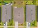 Aerial view showcasing roof, driveway, backyard, and green grass at 1797 Sundance Chase Rd, Minneola, FL 34715