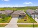 An aerial view of a single-story home in a Primary-planned community at 1797 Sundance Chase Rd, Minneola, FL 34715
