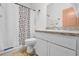 Bathroom featuring a shower/tub combo and white cabinets at 1797 Sundance Chase Rd, Minneola, FL 34715