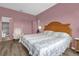 Cozy bedroom featuring wood floors and ensuite bathroom at 1797 Sundance Chase Rd, Minneola, FL 34715