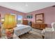 Bedroom featuring wood floors and windows with a view at 1797 Sundance Chase Rd, Minneola, FL 34715