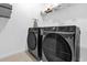 Laundry room featuring front-loading washer and dryer at 1797 Sundance Chase Rd, Minneola, FL 34715