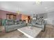 A cozy living area with an open floor plan, chandeliers, and modern decor at 1797 Sundance Chase Rd, Minneola, FL 34715