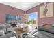 A stylish living room with a sliding glass door leading to the outdoors at 1797 Sundance Chase Rd, Minneola, FL 34715