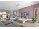 A comfortable living room featuring a large TV and reclining leather sofas at 1797 Sundance Chase Rd, Minneola, FL 34715