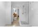 Clean, bright bathroom with tiled shower, updated fixtures, and a glimpse of the vanity area at 1945 Bering Ave, Winter Park, FL 32789