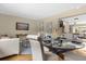 Elegant dining area with modern table setting, stylish chairs, and seamless access to the living room at 1945 Bering Ave, Winter Park, FL 32789