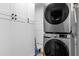 Convenient laundry room equipped with a modern washer and dryer, plus ample storage cabinets at 1945 Bering Ave, Winter Park, FL 32789