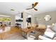 Open-concept living space with modern lighting, hardwood floors, stylish decor, and a view to the dining area at 1945 Bering Ave, Winter Park, FL 32789
