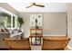 Cozy living room with large window, comfortable seating, hardwood floors, and stylish decor at 1945 Bering Ave, Winter Park, FL 32789