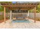 Stylish outdoor area features a pergola with seating, decor, and a fan for comfortable relaxation at 1945 Bering Ave, Winter Park, FL 32789