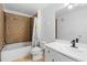 Bathroom features a shower and tub, modern vanity and neutral tile flooring at 1950 Summer Club Dr # 200, Oviedo, FL 32765