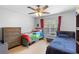 Shared bedroom with two twin beds, dresser, laminate flooring and bright natural light at 1950 Summer Club Dr # 200, Oviedo, FL 32765