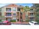 Exterior view of the three-story condominium building with staircases and balconies at 1950 Summer Club Dr # 200, Oviedo, FL 32765