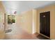Exterior hallway showcasing unit 200 with a black, classic style front door at 1950 Summer Club Dr # 200, Oviedo, FL 32765