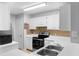 Kitchen features stainless steel appliances and ample counter space at 1950 Summer Club Dr # 200, Oviedo, FL 32765