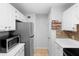 Kitchen has stainless appliances and tiled floor at 1950 Summer Club Dr # 200, Oviedo, FL 32765