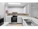 Kitchen features stainless steel appliances and tile flooring at 1950 Summer Club Dr # 200, Oviedo, FL 32765