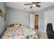 Inviting bedroom with plush carpet, decorative wall art and ample closet space at 1967 Beacon Bay Ct, Apopka, FL 32712