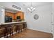 Cozy dining area featuring a wood accent wall, eat-in counter, and seamless flow into the kitchen at 1967 Beacon Bay Ct, Apopka, FL 32712