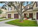 Charming townhouse boasts a two-car garage and beautiful curb appeal at 1967 Beacon Bay Ct, Apopka, FL 32712
