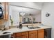 Open kitchen layout with seamless countertops, offering a view to the living area for easy socializing at 1967 Beacon Bay Ct, Apopka, FL 32712