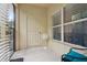 Cozy porch with tile floor, a door to exterior, a fan and great natural light at 1967 Beacon Bay Ct, Apopka, FL 32712