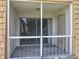 Balcony that is screened in with a view of the outside neighborhood at 200 St Andrews Blvd # 911, Winter Park, FL 32792