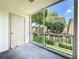 Balcony view featuring a view of the neighborhood and door leading to the interior of the condo at 200 St Andrews Blvd # 911, Winter Park, FL 32792