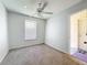 Inviting bedroom equipped with a ceiling fan and a window, providing a comfortable living space at 200 St Andrews Blvd # 911, Winter Park, FL 32792
