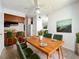 Bright dining room with seating for six, with views of the kitchen and living area at 200 St Andrews Blvd # 911, Winter Park, FL 32792