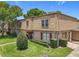 Charming townhome with mature landscaping, brick, siding, and attached garage at 200 St Andrews Blvd # 911, Winter Park, FL 32792