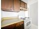 This kitchen features an electric range and lots of upper cabinet storage space at 200 St Andrews Blvd # 911, Winter Park, FL 32792